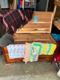 Cedar Chest 16.5in X 40.5in X 18.25in.  Includes Three Crocheted Blankets And Two Wool Textured Blankets