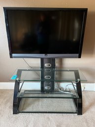 R5 Glass And Metal TV Stand With Attached TV Mount. Vizio TV And Firestick Included
