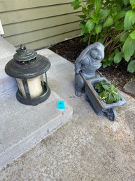 Heavy Metal Lantern With Glass Insert And Cement Rabbit Planter Pushing Wheel Barrel