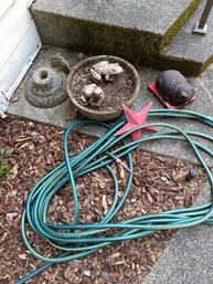 Garden Decor And Water Hose.