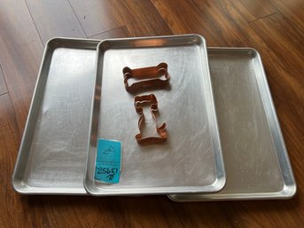 R2  Set Of Three Nordic Ware Cookie Sheets 13in X 18in And Two Copper Colored  Cookie Cutters Approx 5in
