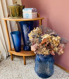 Rm15 Small Side Table With Plastic Blue Jars, Blue Metal Planter Jar With Faux Flowers, And Decorative Boxes