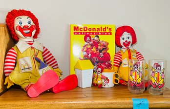 Rm5 McDonalds Collectibles Including A Book, Ronald Mcdonalds , Two Glasses, And Plastic Toys