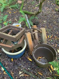 Cement Blocks, 2 Wooden Wheeled Dollies, Large Pots, Stack Of Wood