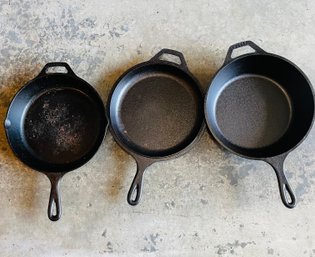 RM0  Three Cast Iron Bread Making Pans In Various Depths