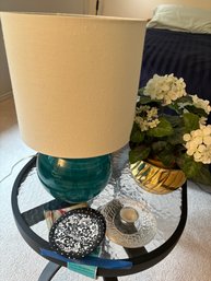 R13 Outdoor Patio Furniture Table To Include Orrefors Tea Votive, Small Lamp, Faux Flowers, And Some Coasters