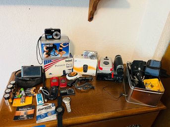 RM4 Electronics Lot Digital Cameras, Wristwatches, Phones, Batteries, Car Stereo, Cords,