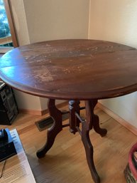 Vintage Round Wooden Parlor Table With Decorative Leg Base