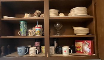 Rm7 Three Cupboards Of Dishes, Glasses, A Teapot, Mugs, Novelty Cups, And Other Kitchen Items