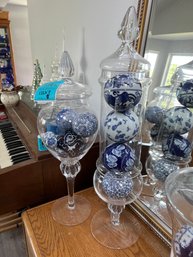 Tall Glass Decorative Jars With Porcelain Blue And White Balls.    Tallest Is 27in