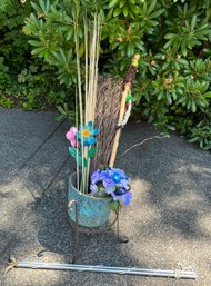 R0 Miscellaneous Decor To Include A Raised Pot, Faux Flowers, Flag And Flag Pole, And More