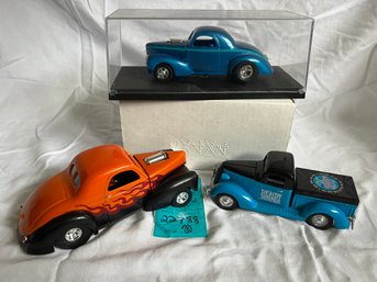 R1 Three Model Cars. Two Die Cast Unknown On Car In Display Case