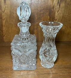 Ornate Crystal Decanter With A Stopper And A Crystal Cut Vase