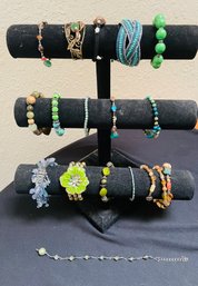 R2 Collection Of Costume Jewelry To Include 16 Bracelets In Green And Earth Tones