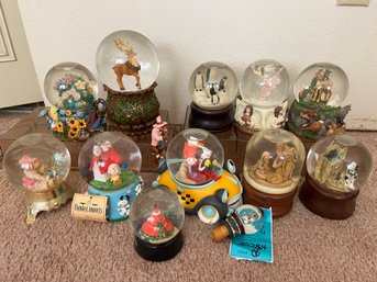 R5 Collection If Snow Globes Including Some Musical And One Wine Stopper Snow Goobe