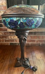 Stained Glass Style Closed Lipped Lamp With Decorative Woman On Stand