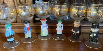 Six Hummel Style Wine Glasses With Different Figurine Stems