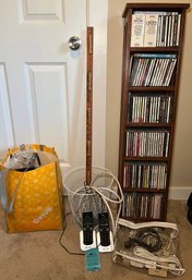 R4 Shelf With CDs, Waste Basket, Cords, Cordless Landline Phones, Measuring Stick With Clothes Pins, And