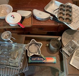 Kitchen Items To Include Trays, Racks, A Small Pot, A Flour Sifter, Graters, Small And Large Omelet Pan