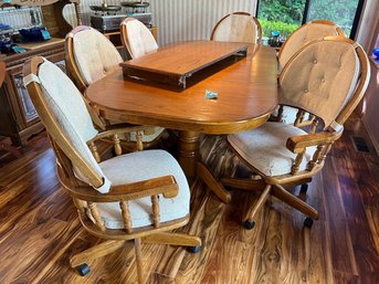 R3 Dining Table With Leaves And Six Wheeled Chairs. 30in X 77in Long With One Leaf Installed  42in Wide. Leave