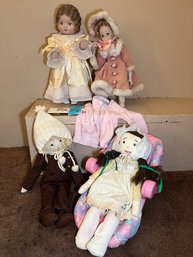 R13 Two Porcelain Faced And Limbed Dolls And Two Stuffed Dolls With Baby Doll Carrier