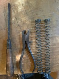 Antique Tools To Include A Screwdriver, Wrench , And Springs