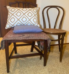 RM4 Two Chairs, One With A Wicker Bottom, Two Pillows, And Two Decorative Sheep And One Linen Piece