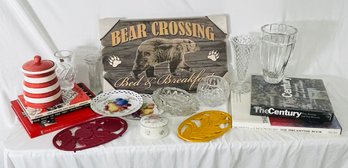 Bear Crossing Bed And Breakfast Sign, Coffee Table Books, Two Midcentury Trivets, Miscellaneous Glassware