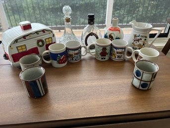 R3 Lot Mugs To Include Christmas And Pottery, Christmas RV Cookie Jar, Decanter, Two Pitchers