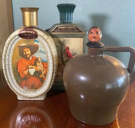 RM1 Lot To Include Decorative Jug, And Two Decorative Souvenir Bottles