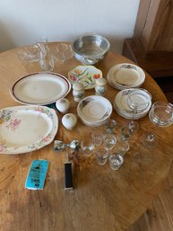 Variety Of Tea Plates, Small Platters, Mismatched Shot Glasses, And Various Kitchen Items