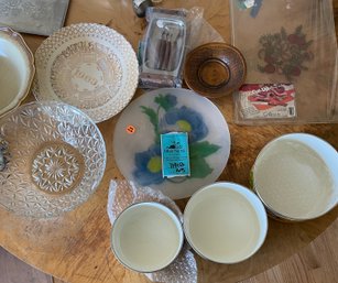 Variety Of Plates, Nesting Bowls, Cutting Board, Small Fondue Set, And Other Kitchen Items