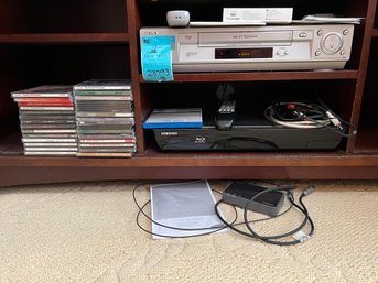 R5 Sony VHS Player, Samsung 5.1 Blu-ray Player, Oticon Digital Analog Ports, Remotes Included.  Music CDs.