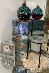 RM1 Lot To Include Michael C Fina Fifth Avenue Quartz Clock, Decorative Glass Oil Lamps, A Candle Holder