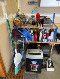Rm0 Left Side Of Workbench. Variety Of Hardware, Radio, Fellowes Paper Shredder, Brooms, Wire Shelf, Hand Tool