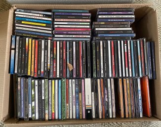 R1 Lot Of CDs, DVDs, VHS Tapes, And A Cd Rack
