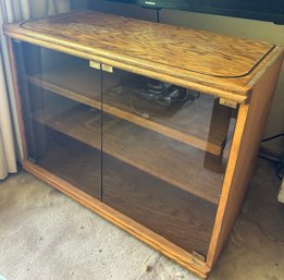 R7 Entertainment Cabinet With Glass Doors On Wheels And A Rollout Shelf, Located Upstairs