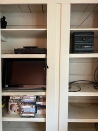 R2 Sharp TV, Sony VHS DVD Player, Soundesign AM/FM Cassette Compact Stereo And Two JBL Bookshelf Speakers. .