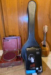 R8 Musical Lot To Include Carlos Banjo In Case, One Mandolin, Sennheiser Wireless Sound Experience RS120, And