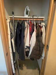 Closet Full Of Mens Jackets, Sweatshirts, An Iron And Ironing Board