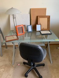 Metal And Glass Desk With Pull Out Drawer, Rolling Office Chair, Chair Mat, Lamp, Cork Board, Frames
