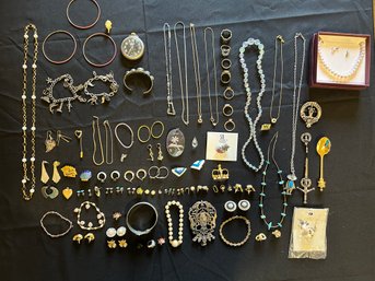 R9 Lot Of Costume Jewelry To Include, Earrings, Necklaces, Pins, And Bracelets