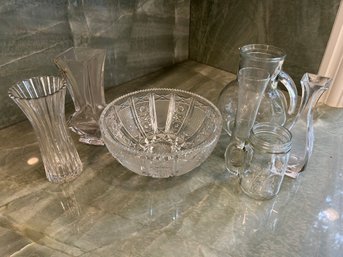 R4 Lot Of Glassware To Include A Large Bowl, Large Pitcher, Various Vases, And A Cup