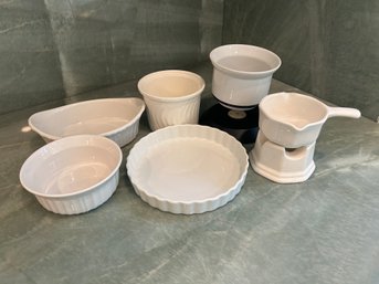 R4 Lot Of Corningware, Porcelain Oven Dishes, Two Candle Holders, Two Cups/mugs