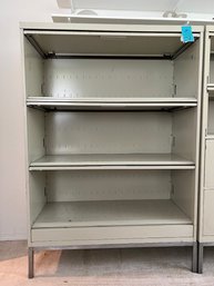 R1 Metal Cabinet With Slide Out Doors  5ft Tall, 3ft 6in Wide, 18in Deep. Each Shelf 14in Opening
