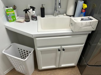 R10 Laundry Room Lot To Include Lot Of Cleaning Supplies, Lots Of Rags And Brooms, Cabinet Full Of Batteries A