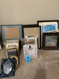 Picture Frames And Hinged Easel Stands. Located Upstairs