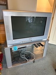 Sony TV, TV Stand, And Sony DVD Player