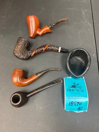 Four Estate Pipes And A Pipe Rest
