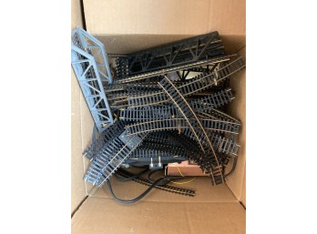 Box Of Train Tracks And Transformers